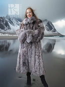 Long gray faux fur coat with wide collar and button-front, worn over black boots.