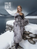 Silver fox fur full-length coat with tiered front panels, worn with black boots
