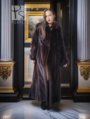 Dark mink coat with high collar, button front, and wide cuffs.