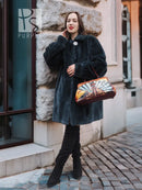 Deep teal sheared muskrat fur coat with high collar and front button, front view