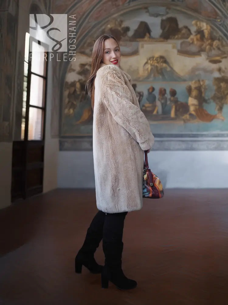 Mid-length sheared beaver coat in light honey-tan, long sleeves, button-front, side pockets