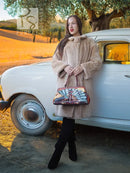 Mid-length sheared beaver coat in light honey-tan, plush texture, long sleeves, button-front
