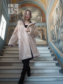 Sheared beaver coat in light honey with cozy collar, front view on steps