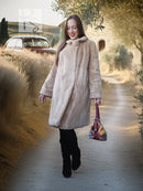 Sheared beaver coat in light honey, full-length front view, fuzzy buttoned style