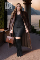 Dark brown mink coat draped open with fur collar and long sleeves