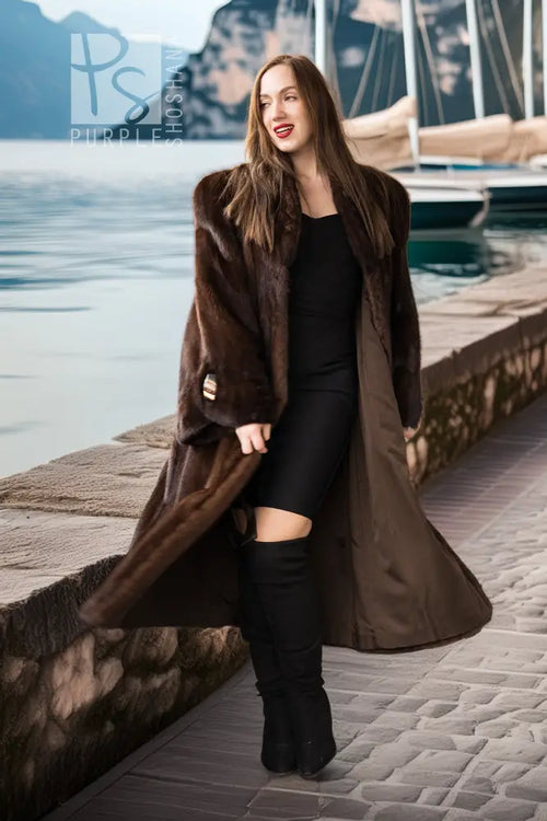 Brown mink coat draped over shoulders with open front and long fur sleeves