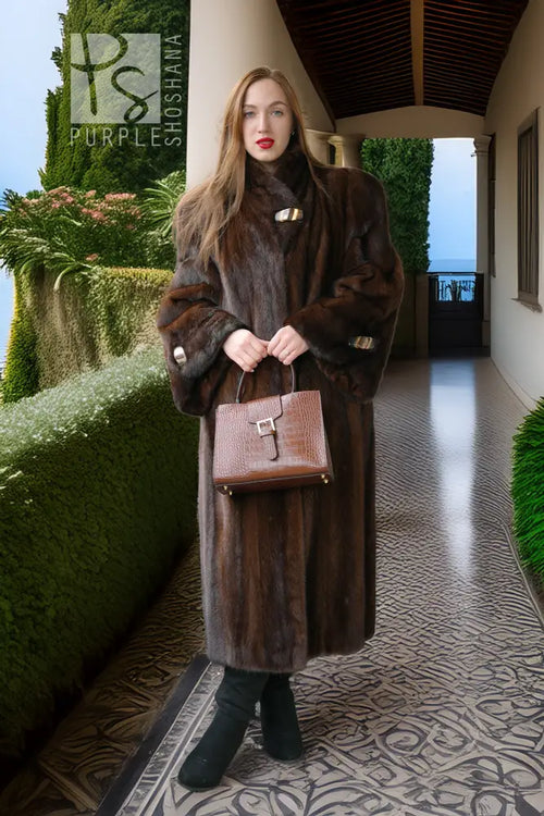 Long dark mink coat with wide fur cuffs and turn-down collar, belted