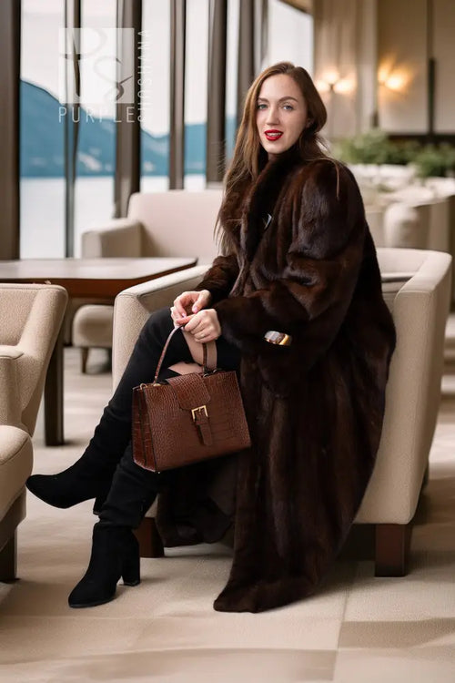 Brown mink coat with wide collar and open front, long sleeves and buttoned cuffs