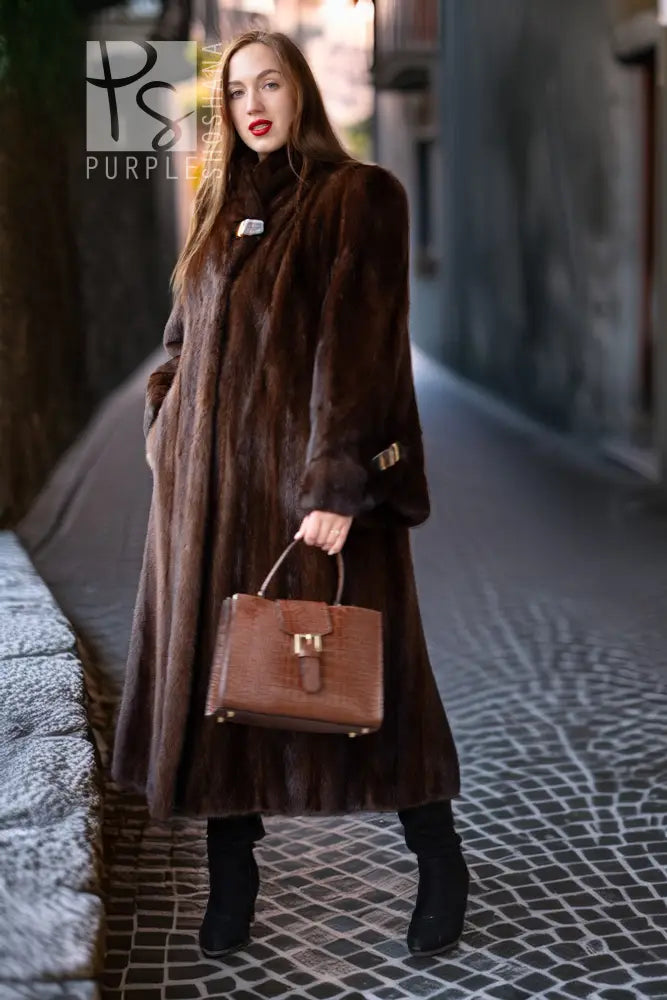 Long dark brown mink coat with wide cuffs, front pockets, belted waist