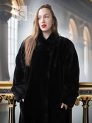 Black sheared beaver fur coat with stand collar; close-up view of face and upper front.