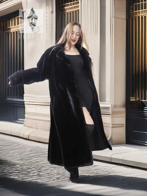 Black sheared beaver fur coat with stand collar; angled full-body pose, long open front.