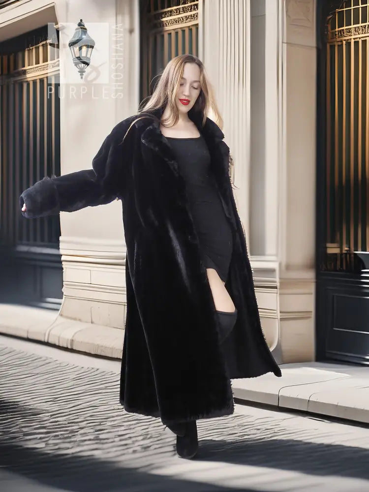 Black sheared beaver fur coat with stand collar; angled full-body pose, long open front.