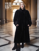 Front-view black beaver fur long coat with V-neck and button front, full sleeves