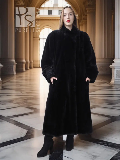 Front-view black beaver fur long coat with V-neck and button front, full sleeves