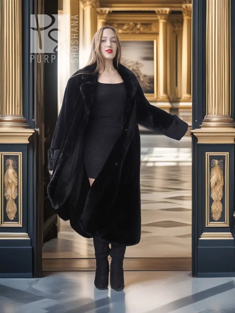 Black sheared beaver fur coat with stand collar; open front over black dress, full-body.