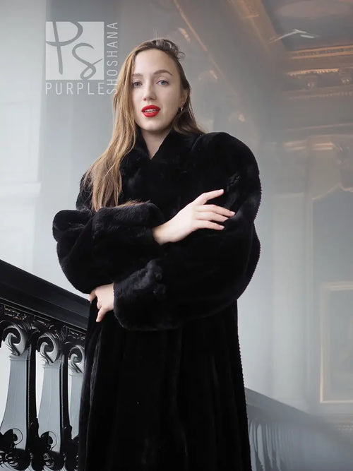 Black fur coat with long sleeves and standing collar, front view