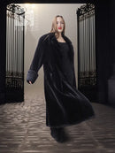 Black sheared beaver fur coat with stand collar; front view, long open coat hem.