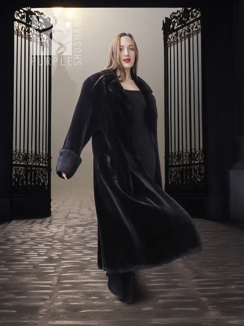 Black sheared beaver fur coat with stand collar; front view, long open coat hem.