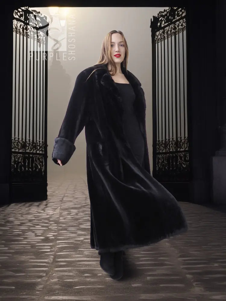 Black sheared beaver fur coat with stand collar; front view, long open coat hem.