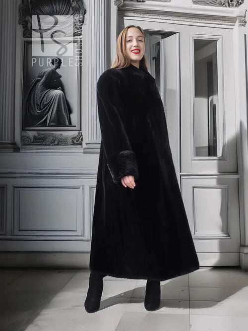 Long black fur coat with high neckline and straight skirt hem