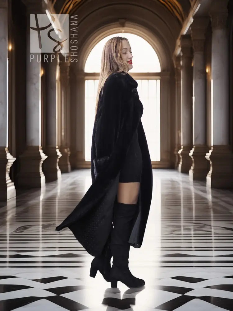 Black sheared beaver fur coat with stand collar; side profile, long flared hem.