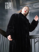 Black sheared beaver fur coat with stand collar; side view, long sleeves and open front.