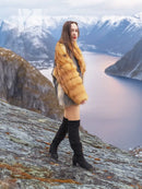 Two-tone fur coat with golden fox fur sleeves and gray body, full-length side pose