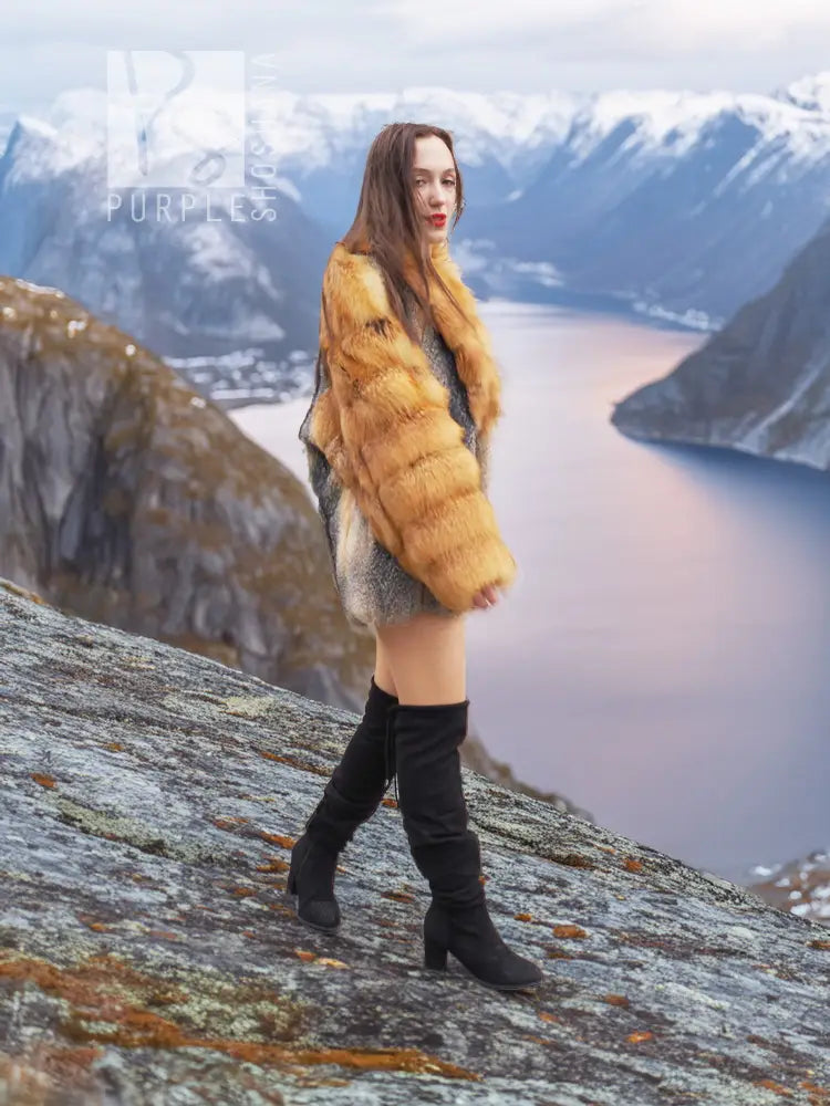 Two-tone fur coat with golden fox fur sleeves and gray body, full-length side pose