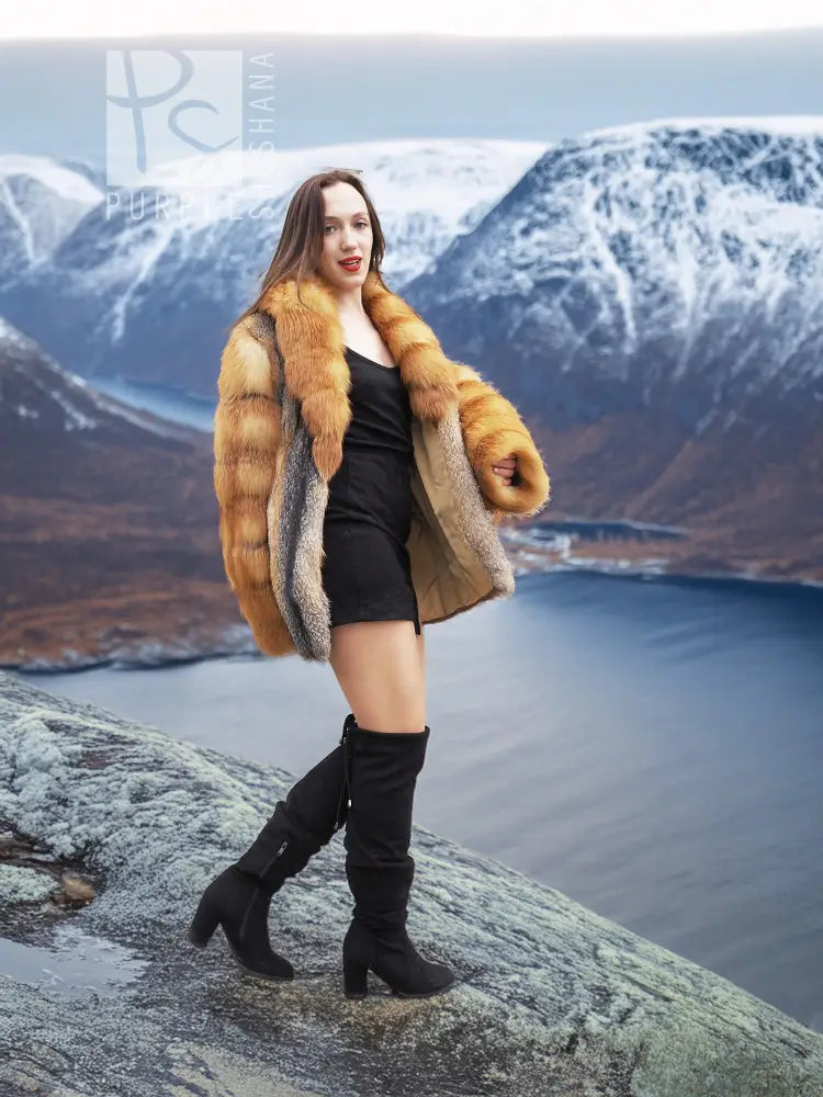Two-tone fur coat with golden fox-style sleeves and gray fur front over a black dress