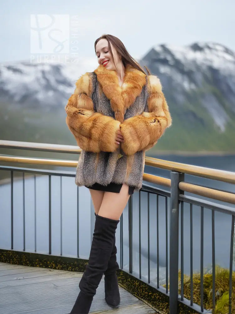 Fur coat with gray body and orange fox fur collar, holding hands together view