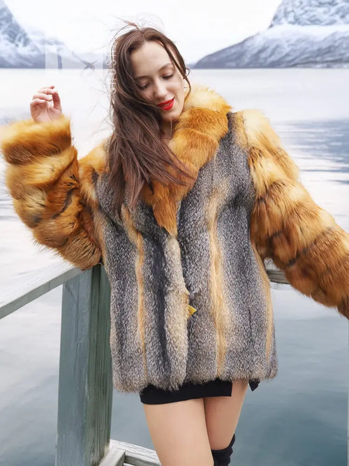 Fur coat with gray textured fabric and orange fox fur cuffs, close-up shoulder view