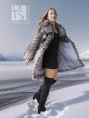 Silver fox faux fur hooded coat with flared hem, black inner top and boots.
