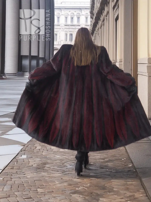 Two-tone mink fur coat, dark with red accents, full-length swing, back view