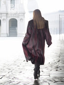 Two-tone mink fur coat, dark with red accents, long sleeves, full-length, back view