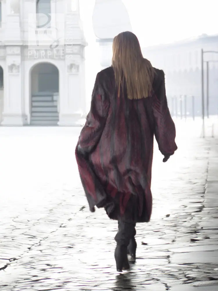 Two-tone mink fur coat, dark with red accents, long sleeves, full-length, back view