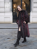 Two-tone mink fur coat, dark with red accents, button-front style, side view