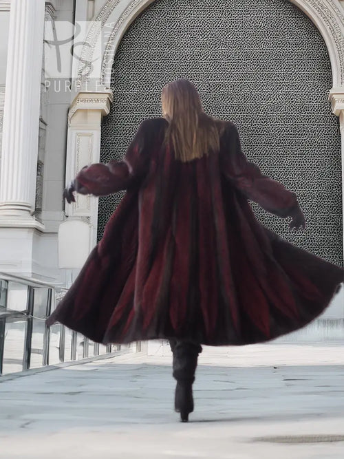 Back view hooded mink fur coat, black and burgundy tones, flared hem