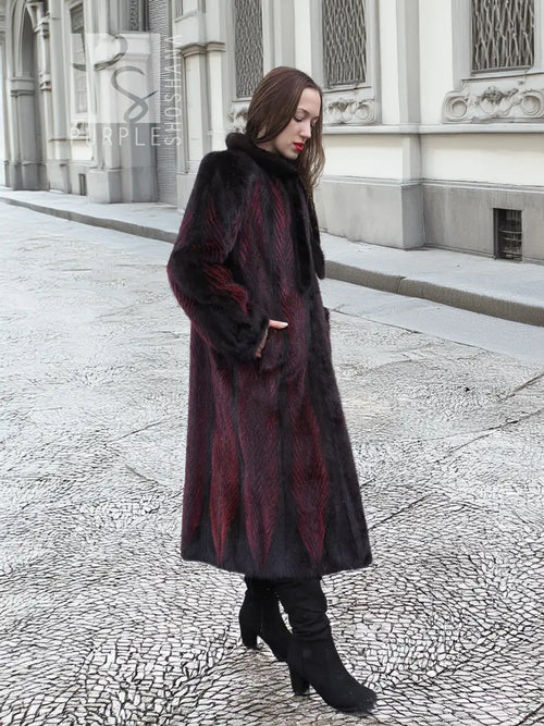 Two-tone mink fur coat, dark with red accents, tall collar, side profile
