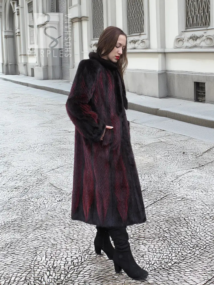 Two-tone mink fur coat, dark with red accents, tall collar, side profile