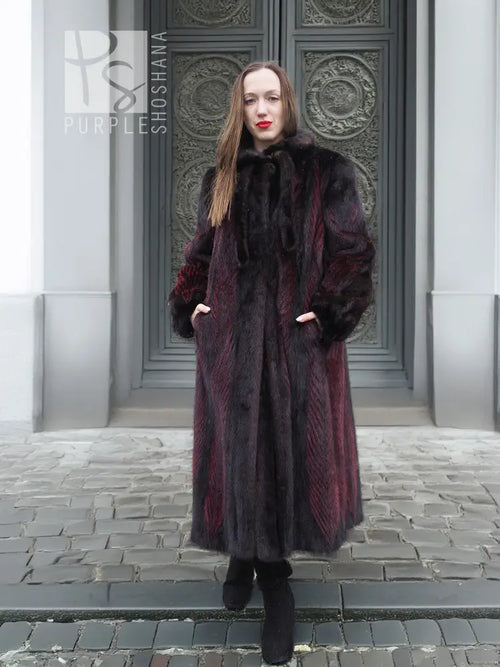 Two-tone mink fur coat with hood, black and burgundy panels, long sleeves