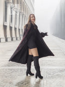 Two-tone mink fur coat with flowing hem, dark with red accents, long sleeves, open front