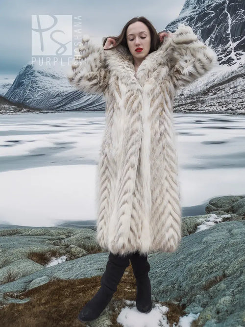 Cream two-tone faux fur coat with shawl collar, chevron pattern, full-length on model