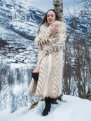 Cream two-tone faux fur coat with shawl collar, chevron pattern, profile view
