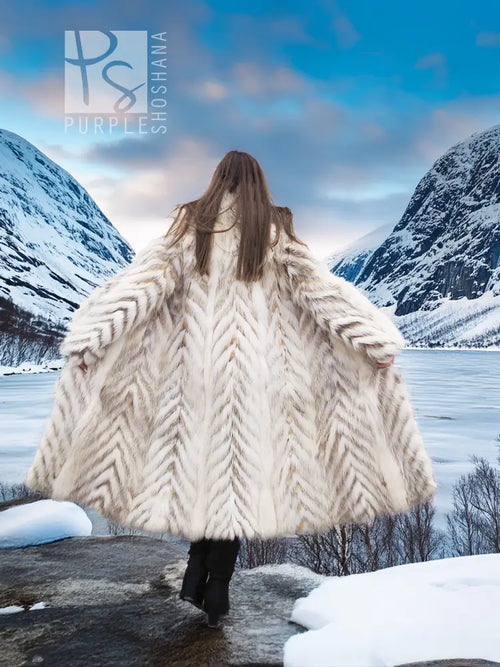 Cream two-tone faux fur coat with shawl collar, chevron pattern, back view