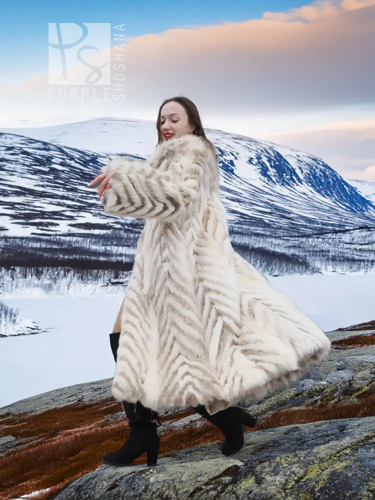 Cream two-tone fox-fur coat with chevron pattern and flowing shawl collar
