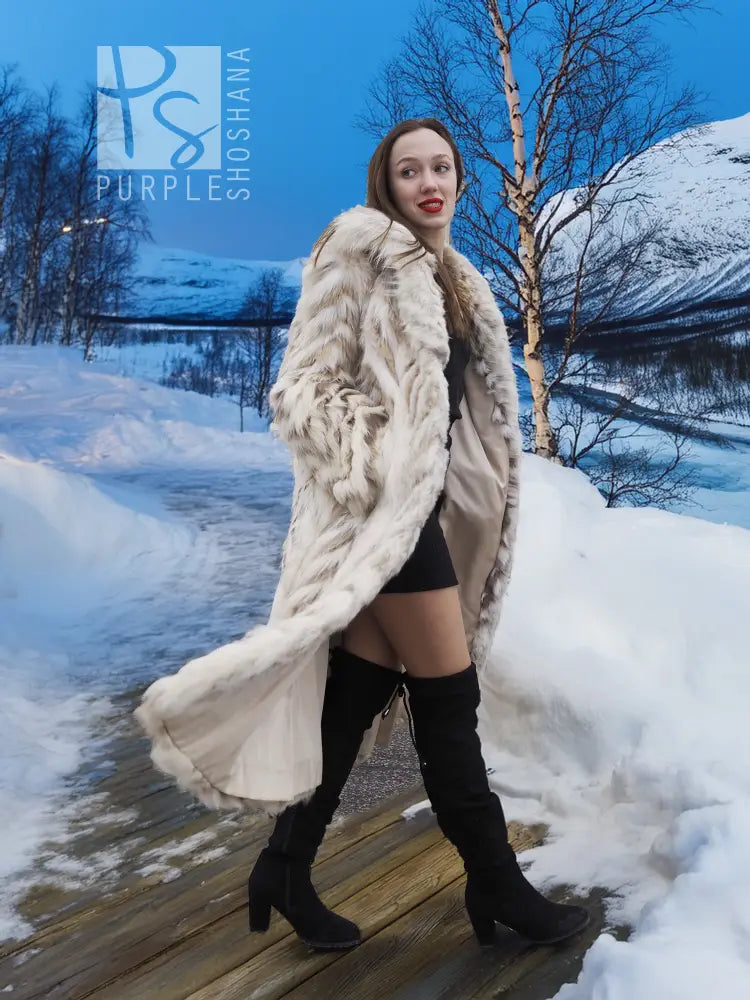 Cream two-tone fox-fur coat with long sleeves, shawl collar, and chevron design