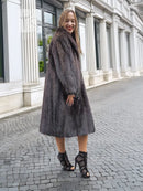 Two-tone muskrat fur coat, draped front and long sleeves, midi hem