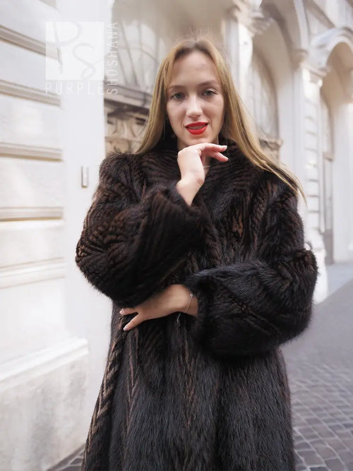 Two-tone muskrat fur coat close-up, high collar and two-tone herringbone fur