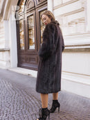 Muskrat fur coat with two-tone finish and long sleeves, mid-calf length