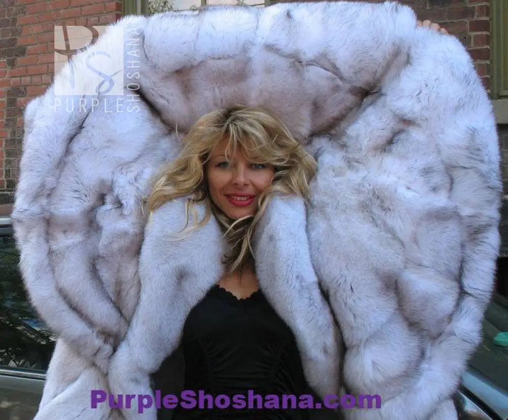 Plush light fur hooded coat with large hood opening and soft padded collar